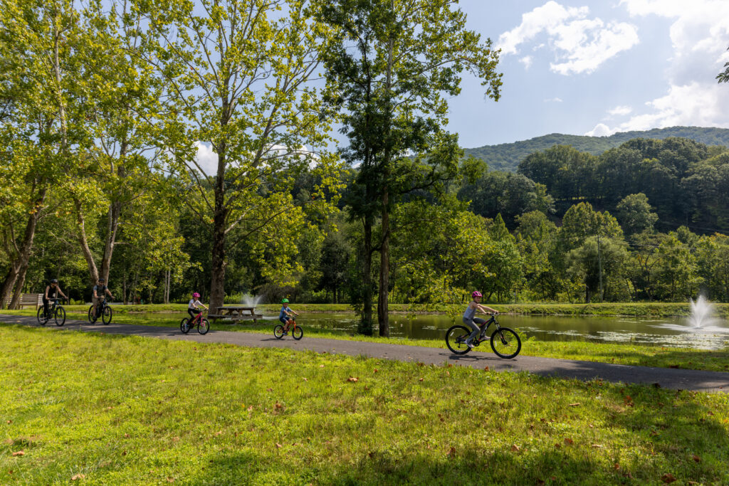 Family biking by riverfront in Parsons, West Virginia