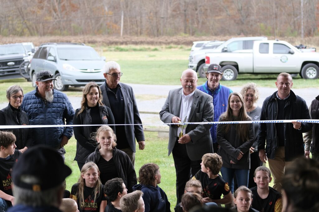 Students from Marlinton Elementary School and Pocahontas County’s Youth Mountain Biking Program join Stakeholders for the Ceremonial Ribbon Cutting.