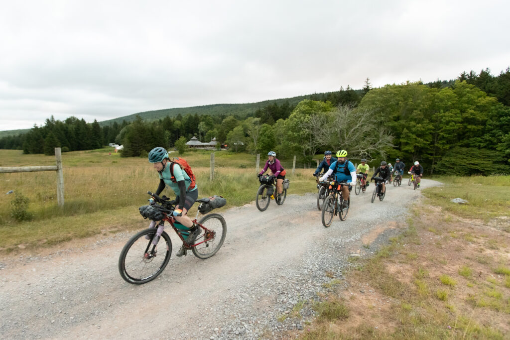 Multiple gravel bikers depart Spruce Knob for the GRUSK Event in 2024.